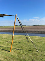 Beige ratchet strap attached to a stretch tent